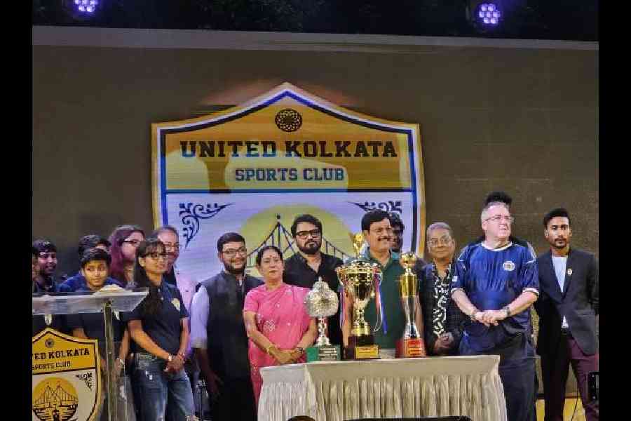 The silverware won by the United Kolkata Sporting Club men's and women's teams being displayed in front of guests at the academy launch