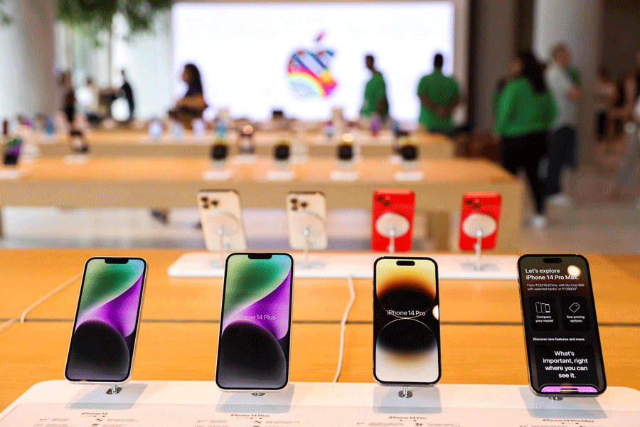 FILE PHOTO: Apple iPhones are seen inside India's first Apple retail store, a day ahead of its launch, in Mumbai