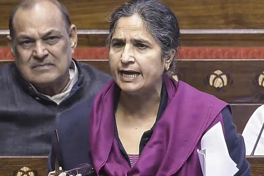 Stranded passengers search for their luggage near a counter after IndiGo cancelled more than 400 flights, at the Kempegowda International Airport, in Bengaluru, Karnataka, Friday, Dec. 5, 2025.