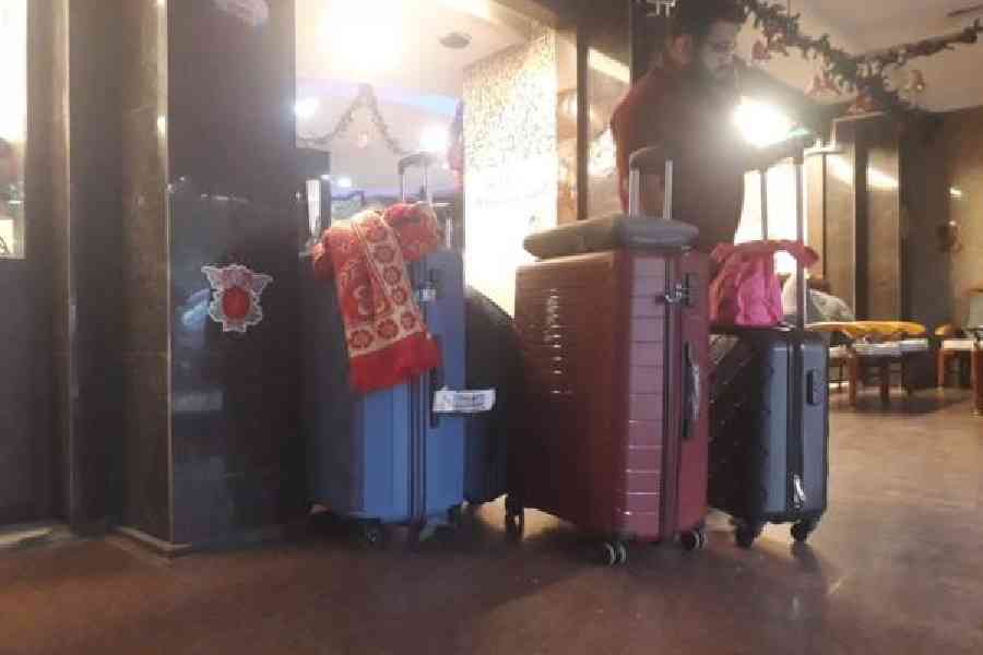 A passenger checks into a hotel near the airport after his Friday-evening Bengaluru flight was cancelled. Picture by Bishwarup Dutta
