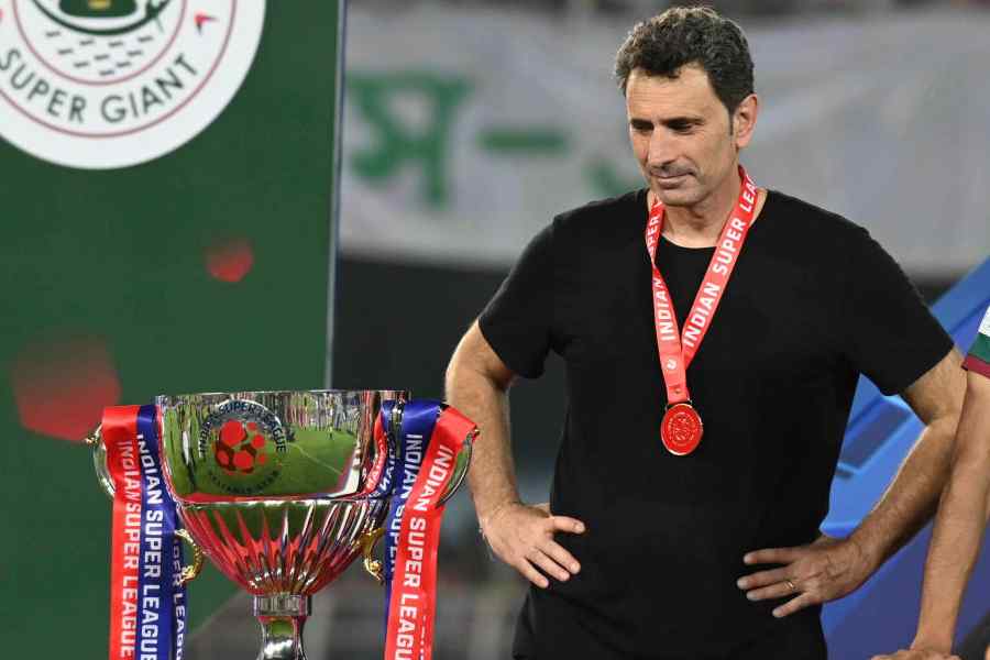 Mohun Bagan Super Giant head coach Jose Molina admires the ISL Cup after Saturday's 2-1 win over Bengaluru FC at the Salt Lake Stadium.