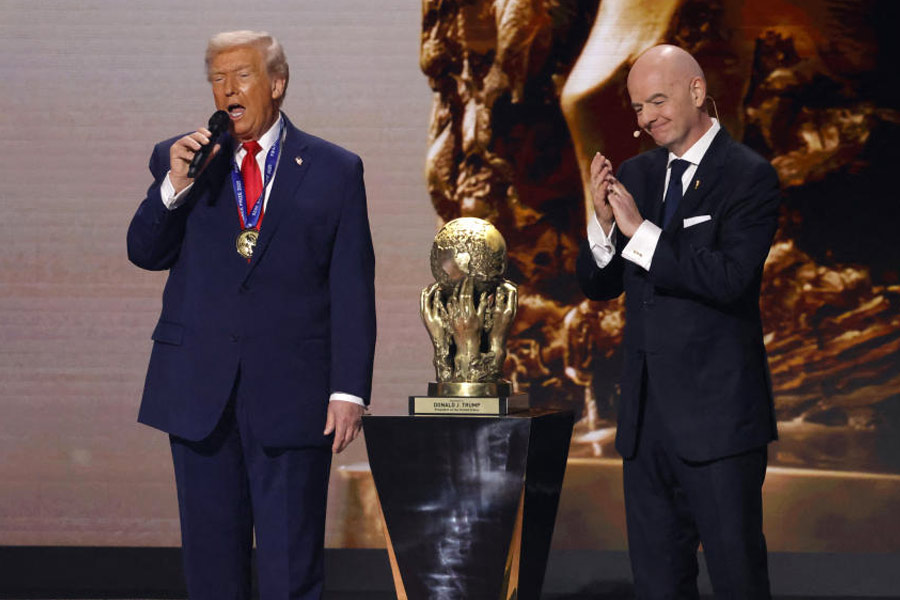 FIFA president Gianni Infantino presents United States President Donald Trump with the FIFA Peace Prize during the FIFA World Cup 2026 Final Draw at John F. Kennedy Center for the Performing Arts.