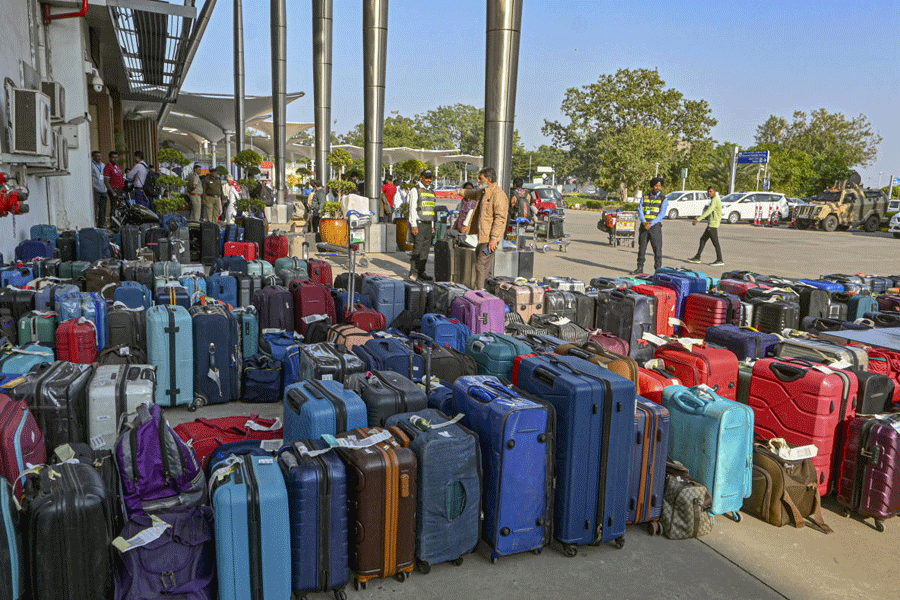 Checked-in luggage of stranded passengers kept outside Sardar Vallabhbhai Patel International Airport amid IndiGo flight disruptions, in Ahmedabad.