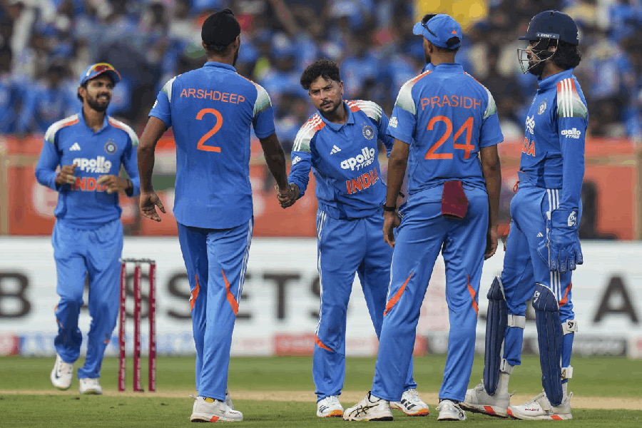 India's Kuldeep Yadav with teammates celebrates after taking the wicket of South Africa's Marco Jansen during the third ODI cricket match of a series between India and South Africa, at ACA-VDCA Cricket Stadium, in Visakhapatnam, Andhra Pradesh, Saturday, Dec. 6, 2025.