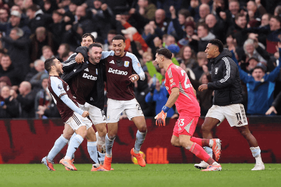 Aston Villa's Emiliano Buendia celebrates scoring their second goal with teammates against Aston Villa.