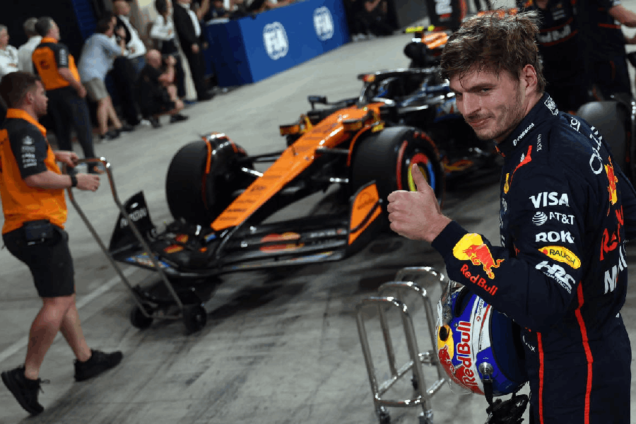 Red Bull's Max Verstappen celebrates after qualifying in pole position.