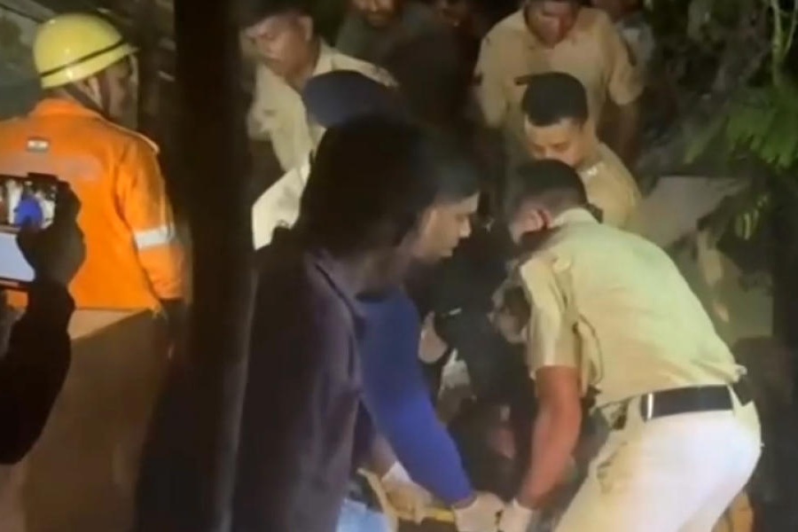 A victim being rescued after a fire broke out following a cylinder blast at a nightclub late Saturday night, in North Goa, Sunday, Dec. 7, 2025.