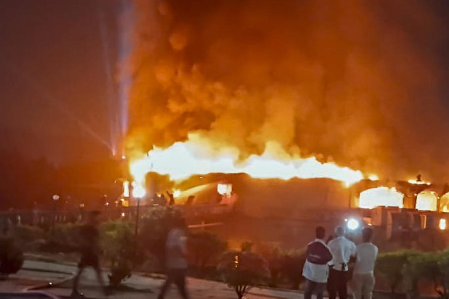 Smoke and flames billow after a fire broke out due to a cylinder blast at a nightclub, in North Goa, after midnight on Sunday, Dec. 7, 2025. At least 23 people were killed in the incident, according to officials.
