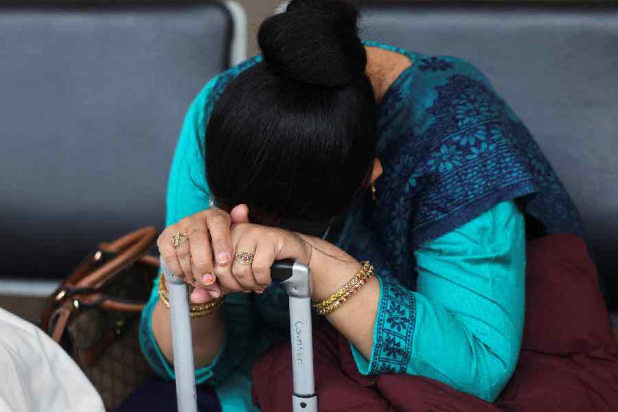 A passenger waits outside the IndiGo Airlines ticketing counter at Terminal 1 of Mumbai's domestic airport