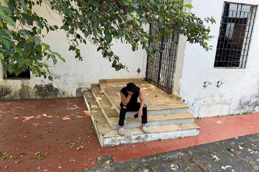 A man mourns the death of his cousin, Jitender Rawat, 24, while sitting outside the morgue at Goa Medical College