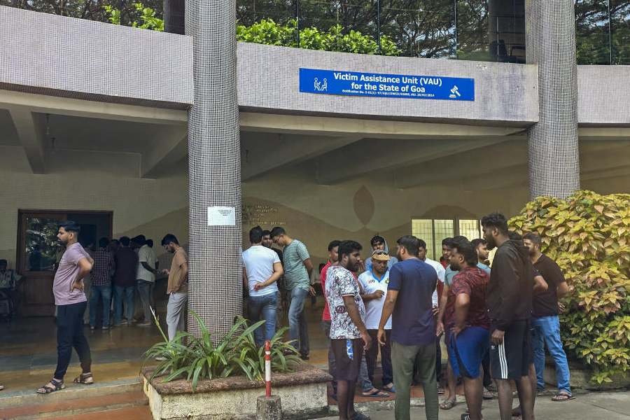 Family members and relatives of victims wait outside Goa Medical College and Hospital after a fire broke out at a nightclub due to a cylinder blast, at Bambolim in North Goa district, Sunday, Dec. 7, 2025.