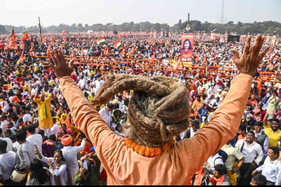 People take part in the ‘five-lakh-voices Gita chanting’ event at the Brigade Parade Ground in Calcutta on Sunday. (PTI picture)