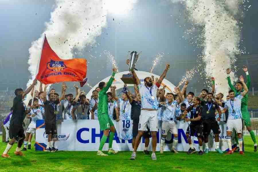 Jubilant FC Goa players celebrate with the AIFF Super Cup in Fatorda, Goa, on Sunday.