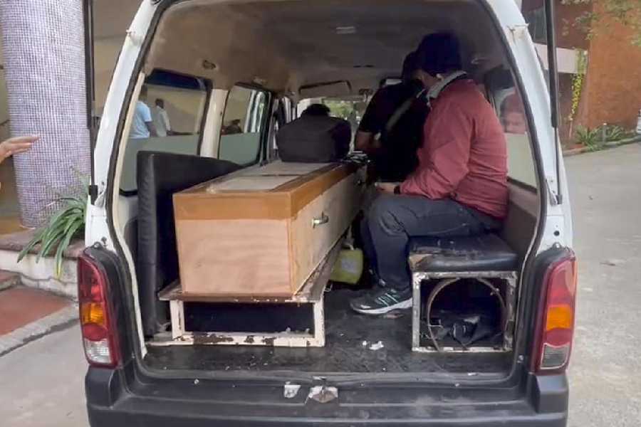 Family members collect the body of a victim from the Goa Medical College on Monday.