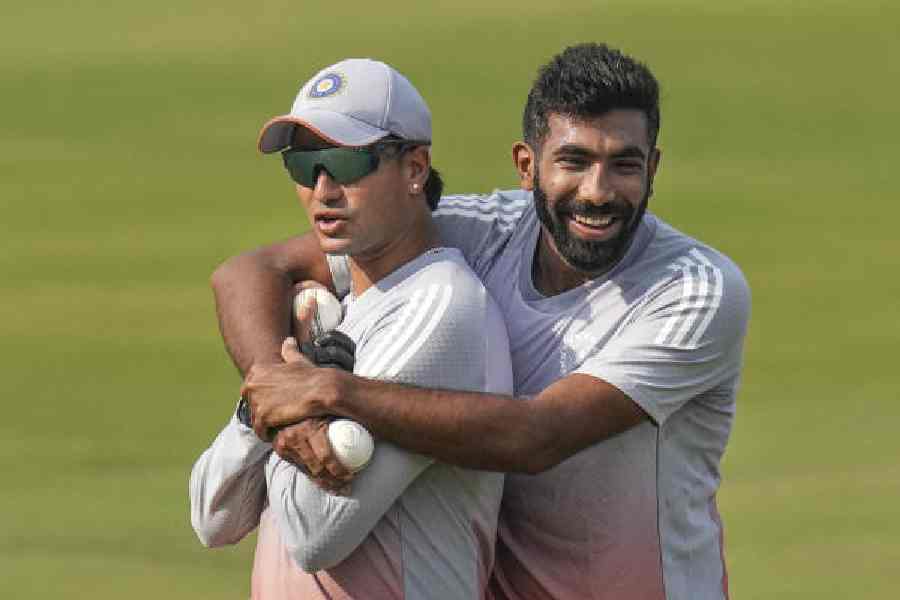 Jasprit Bumrah with Abhishek Sharma during a break in practice in Cuttack on Monday, on the eve of the first T20I against South Africa.