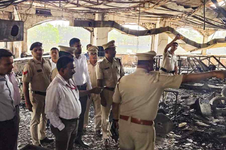 Police and forensic personnel inspect the site where a fire killed 25 people at the Birch by Romeo Lane nightclub, in Arpora, Goa, Monday, Dec. 8, 2025.