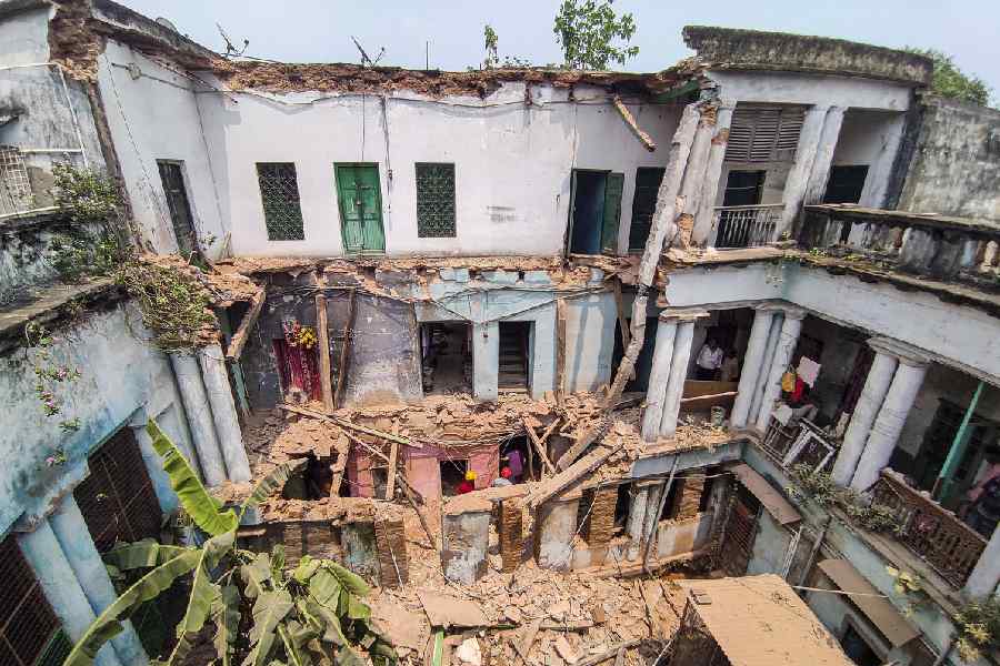 Debris at the site after a portion of an over-a-century-old building collapsed in Kolkata's Bowbazar area, Sunday, June 8, 2025.