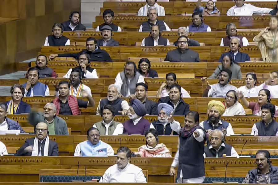 Leader of Opposition in the Lok Sabha Rahul Gandhi with party MP K.C. Venugopal during a discussion on election reforms in the House in the Winter session of Parliament