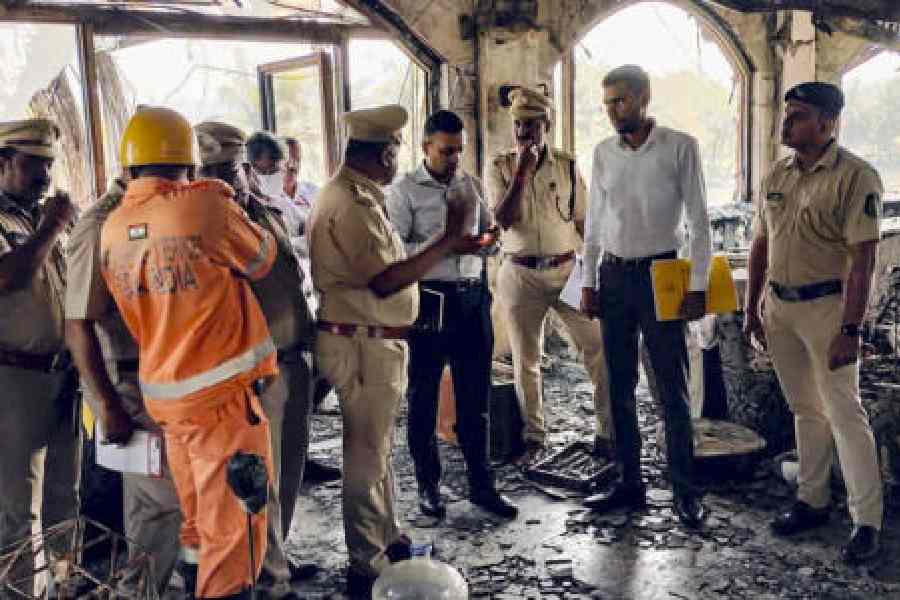 Police and forensic personnel inspect the Birch by Romeo Lane nightclub in Goa on Monday. 