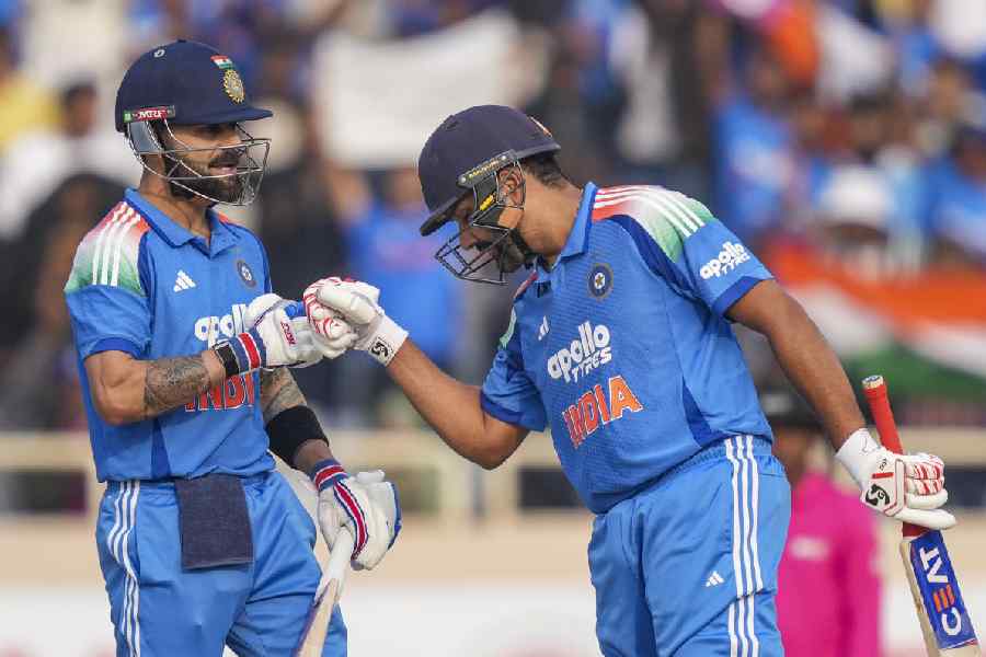 India's Virat Kohli, left, celebrates his half century with Rohit Sharma during the first ODI cricket match of a series between India and South Africa, at JSCA International Stadium Complex, in Ranchi, Jharkhand, Sunday, Nov. 30, 2025.