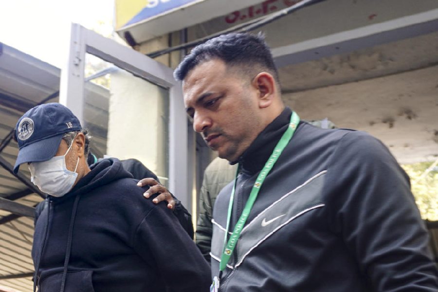 Goa Police bring Ajay Gupta, one of the four owners of the 'Birch by Romeo Lane' nightclub, to the Sunlight Colony Crime Branch office in connection with the North Goa fire tragedy that kills 25 people, in New Delhi, Wednesday, Dec. 10, 2025.