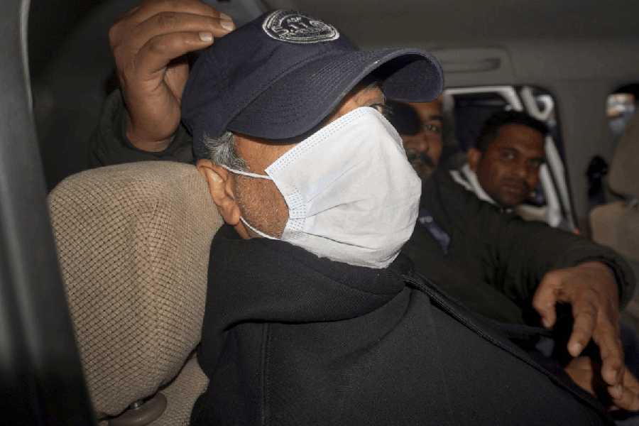 Goa Police bring Ajay Gupta, one of the four owners of the 'Birch by Romeo Lane' nightclub, to the Sunlight Colony Crime Branch office in connection with the North Goa fire tragedy that kills 25 people, in New Delhi, Wednesday, Dec. 10, 2025.