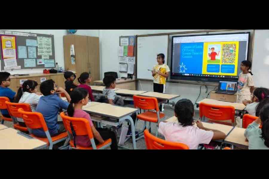 Class V students address their juniors on screen time at Calcutta International School