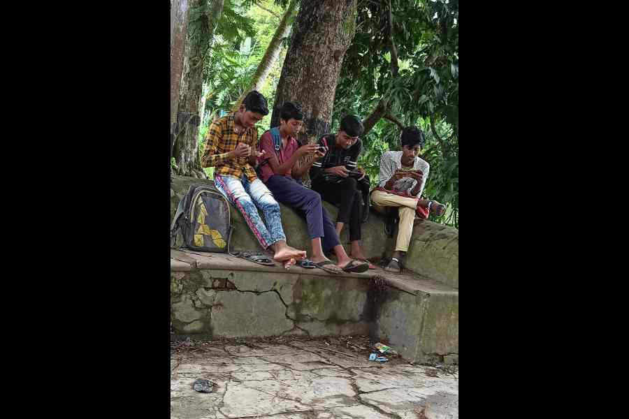 Students busy with their phones. According to educators, phone etiquette is an important lesson