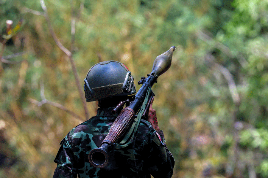 FILE PHOTO: A soldier from the Karen National Liberation Army (KNLA) carries an RPG launcher at a Myanmar military base at Thingyan Nyi Naung village on the outskirts of Myawaddy