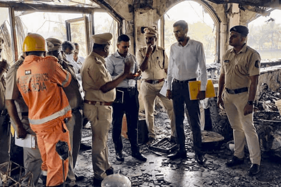 Police and forensic personnel inspect the site where a fire killed 25 people at the Birch by Romeo Lane nightclub, in Arpora, Goa, Monday, Dec. 8, 2025.