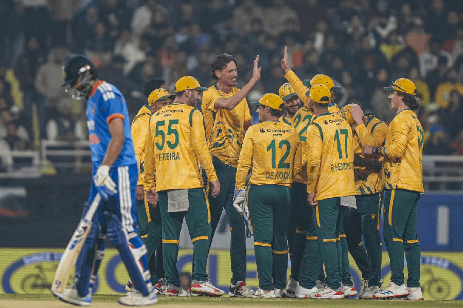 South Africa's players celebrate after a successful DRS review for the wicket of India's captain Suryakumar Yadav during the second T20 International cricket match of a series between India and South Africa, at Maharaja Yadavindra Singh International Cricket Stadium, in New Chandigarh, Thursday, Dec. 11, 2025.