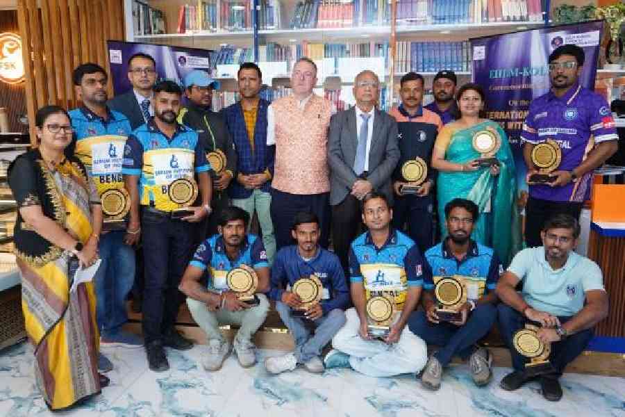 Specially-abled cricketers pose with Andrew Fleming and others at EIILM-Kolkata in Sector V