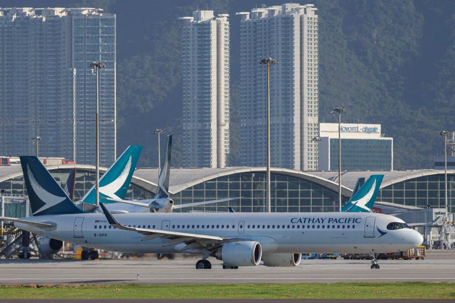 FILE PHOTO: A Cathay Pacific aircraft taxis at Hong Kong International Airport on the day of the official launch of its third runway, in Hong Kong, China November 28, 2024.