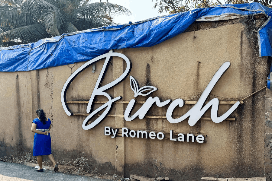 File photo: A woman walks past the Birch by Romeo Lane nightclub, which has been sealed for investigation following a fire that killed multiple people, in Goa, India, December 7, 2025.