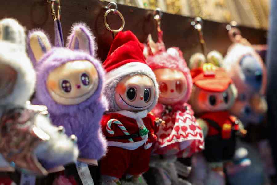 A Labubu in a Santa Claus outfit is displayed at a holiday market in Times Square in Manhattan.