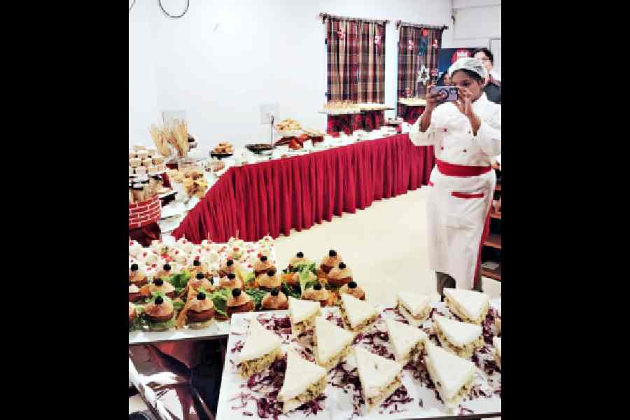 A student of IAM clicks the spread laid out by them