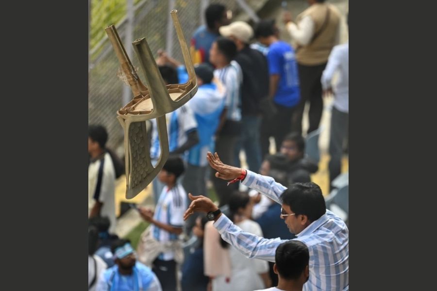 Fans in the second tier flinged stadium chairs at the ground