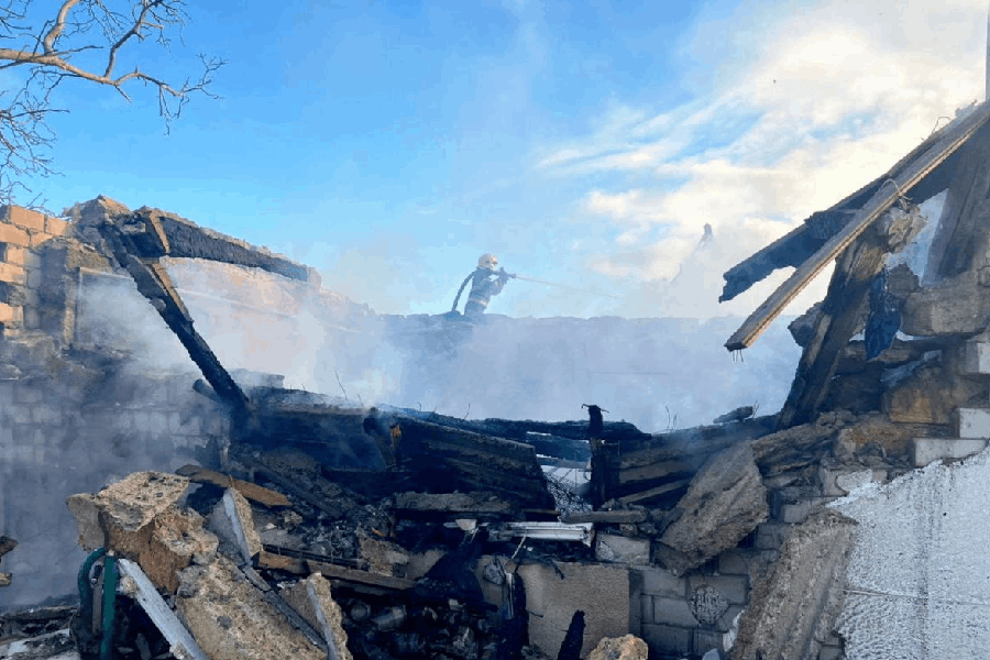 A firefighter works at the site of a Russian missile and drone strike, amid Russia's attack on Ukraine, in Odesa region, Ukraine, in this handout picture released December 13, 2025.