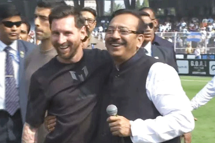 Bengal minister Aroop Biswas with Lionel Messi.