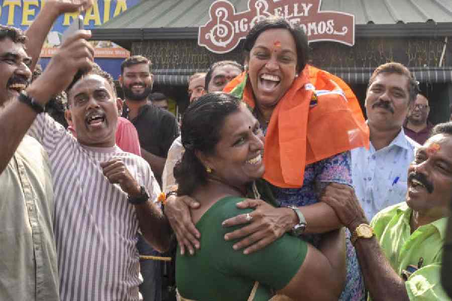 BJP members celebrate during the counting of votes in Thiruvananthapuram on Saturday.