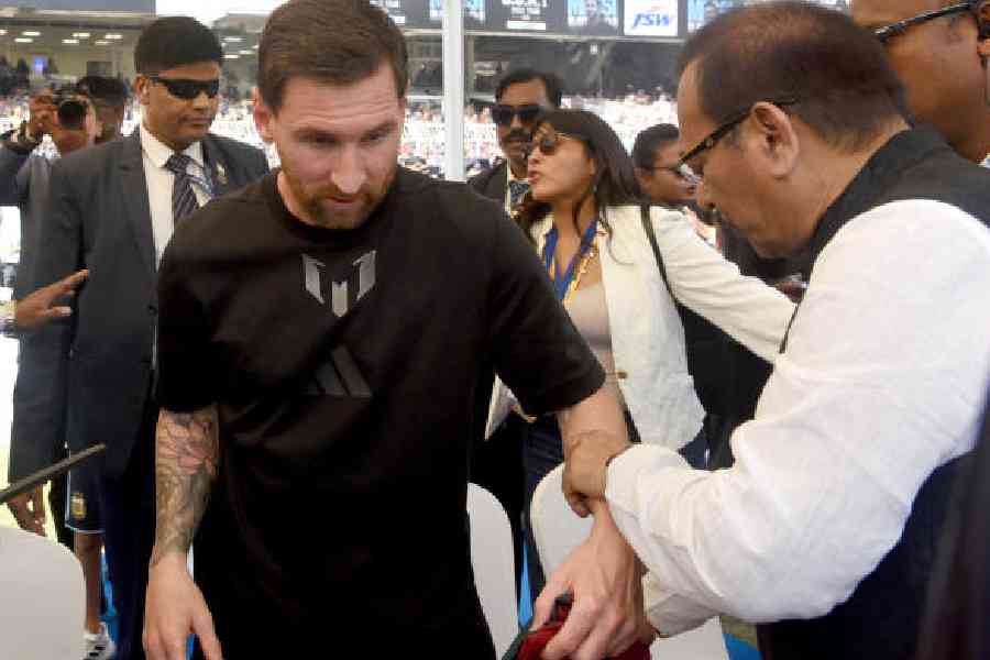 Lionel Messi with minister Aroop Biswas at the Salt Lake Stadium, Calcutta, on Saturday. Picture by Sanat Kr Sinha