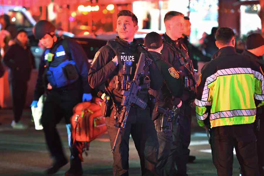Law enforcement officials gather near Brown University in Providence, R.I., on Saturday, Dec. 13, 2025, during the investigation of a shooting.
