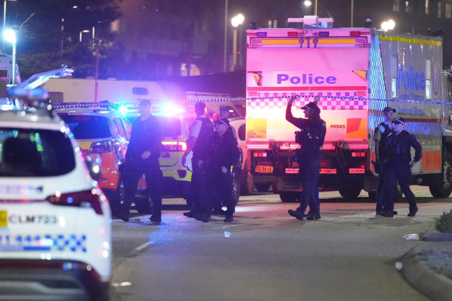 Police cordon off an area at Bondi Beach after a reported shooting in Sydney, Sunday, Dec. 14, 2025.