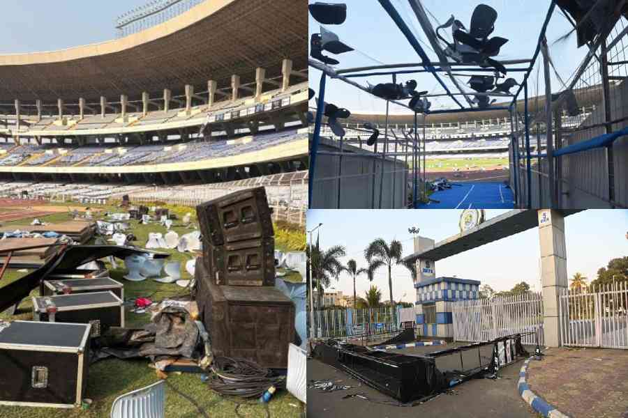 Damaged speakers, amplifiers and other components of the sound system, along with broken bucket seats, lie at the Salt Lake Stadium on Sunday. Pictures by Bishwarup Dutta