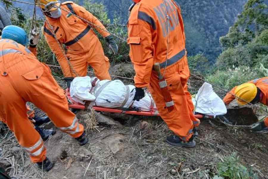NDRF personnel carry a body out of the gorge near Anjaw in Arunachal Pradesh on Sunday