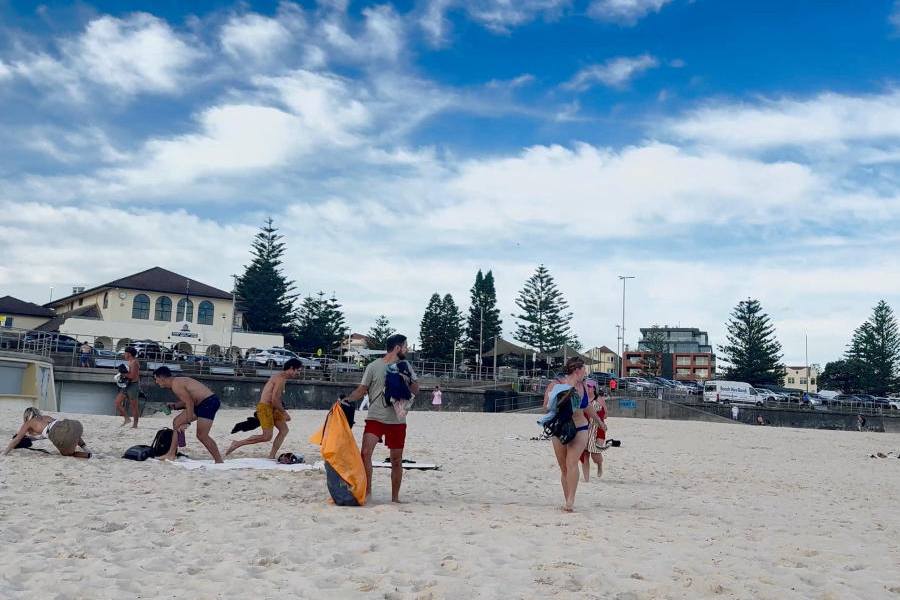 People run for cover at the scene of a shooting incident at Bondi Beach in Sydney, Australia, December 14, 2025, in this screen grab obtained from social media video.