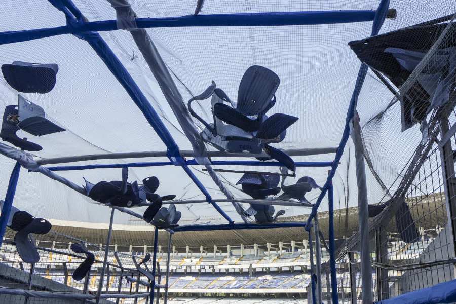 Broken plastic seats scattered at Salt Lake Stadium premises in the aftermath of chaos during an event featuring Argentine football icon Lionel Messi, in Kolkata, Sunday, Dec. 14, 2025.