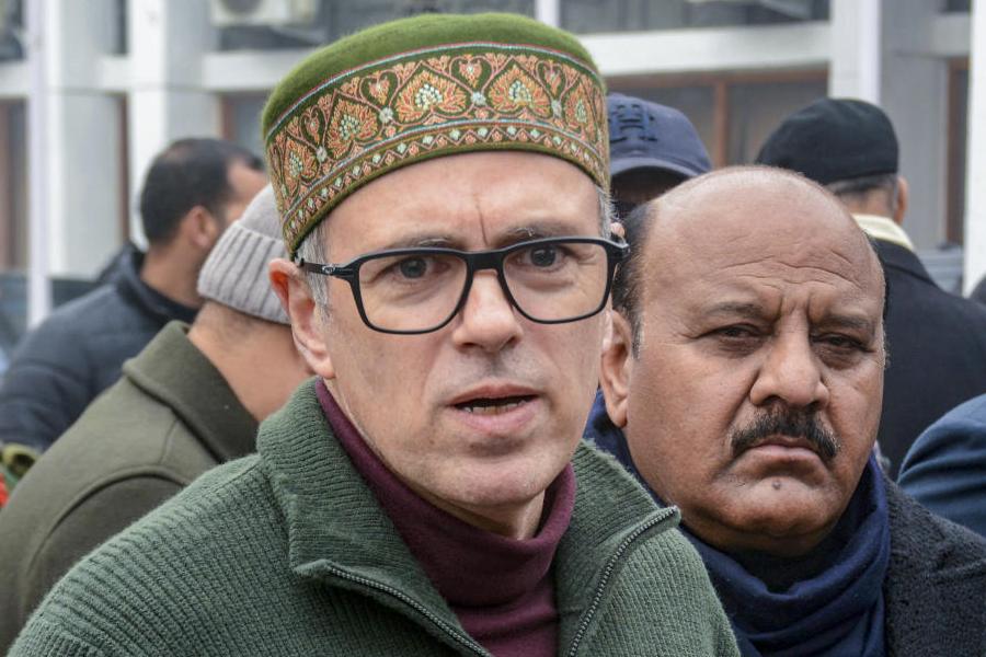 Jammu and Kashmir Chief Minister Omar Abdullah with Deputy CM Surinder Kumar Choudhary addresses a press conference, in Srinagar, Monday, Dec. 15, 2025.