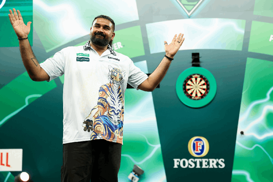 Nitin Kumar celebrates a historic first win for India at the  PDC World Darts Championship