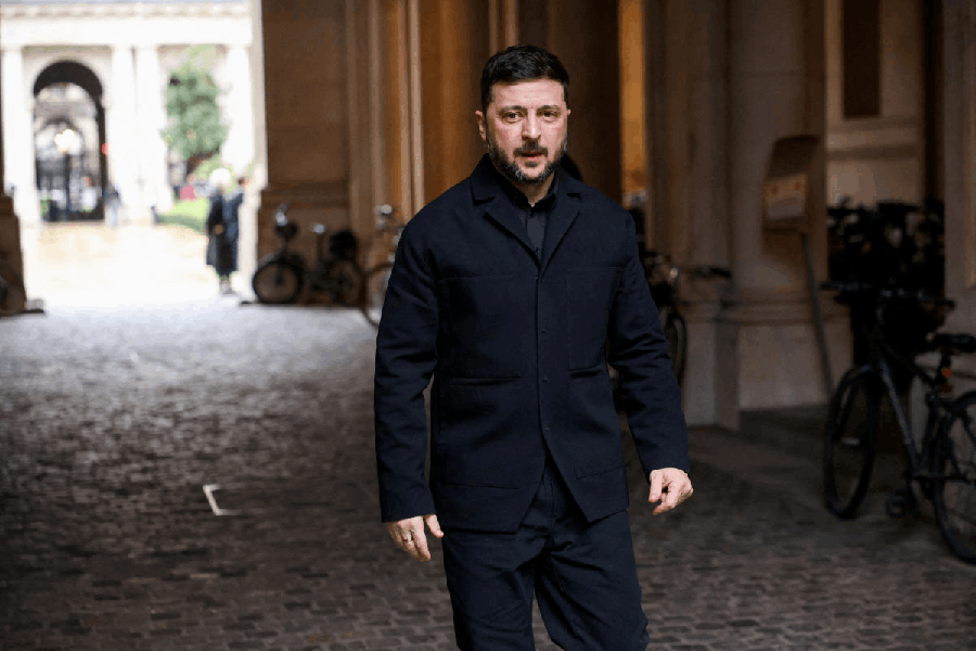 Ukrainian President Volodymyr Zelenskiy arrives for a meeting with E3 partners France, Germany and Britain in London, Britain, December 8, 2025.